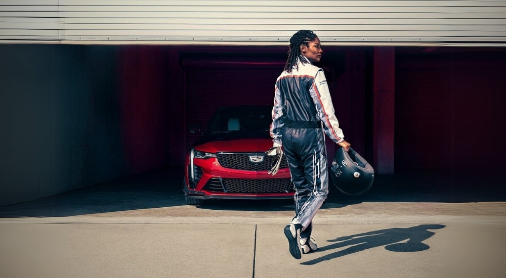 A red 2024 Cadillac CT4-V Blackwing is shown parked in a garage near an Cadillac dealer serving Owatonna.