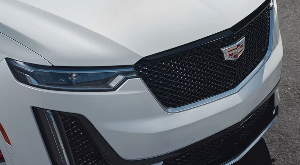 A close up of the front of a white 2024 Cadillac XT6 for sale is shown.