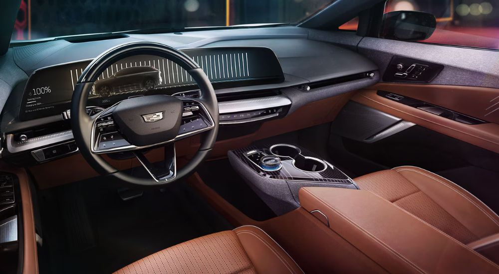 Brown leather upholstery in the cabin of a 2025 Cadillac OPTIQ for sale.
