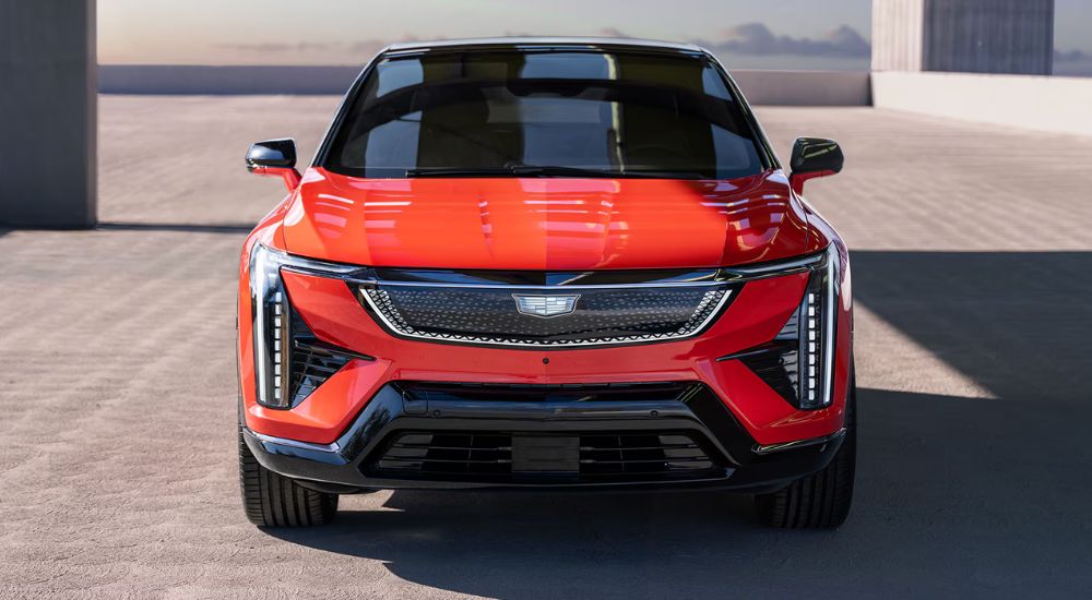 Head-on view of a red 2025 Cadillac OPTIQ Sport.