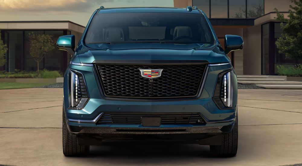 Head-on view of a teal 2025 Cadillac Escalade for sale near Minneapolis.