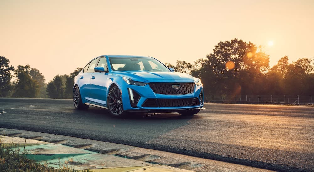 A blue 2023 Cadillac CT5-V Blackwing on a track.