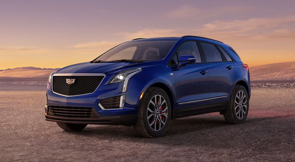 A blue 2026 Cadillac XT5 parked off-road