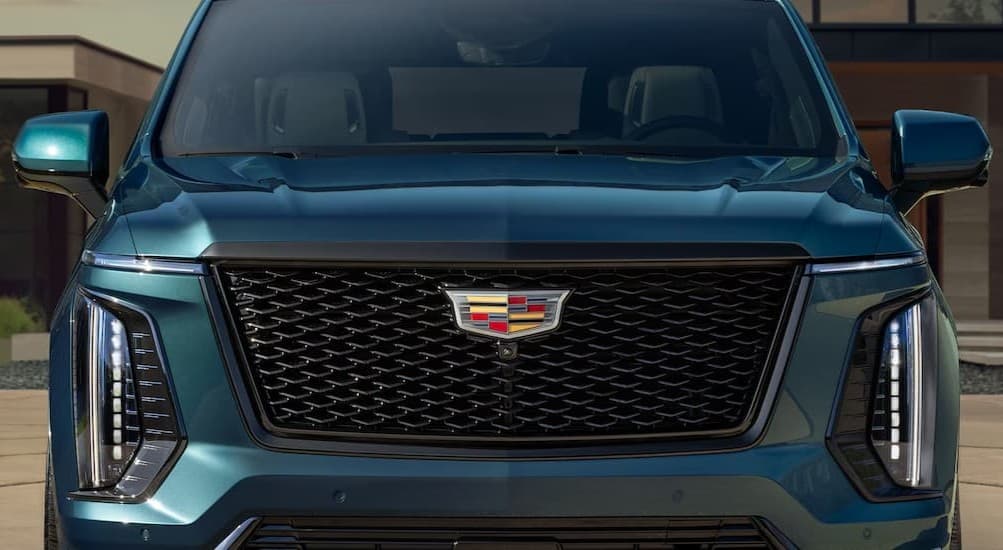 Close-up of frontend of a blue 2026 Cadillac Escalade for sale in Mankato.