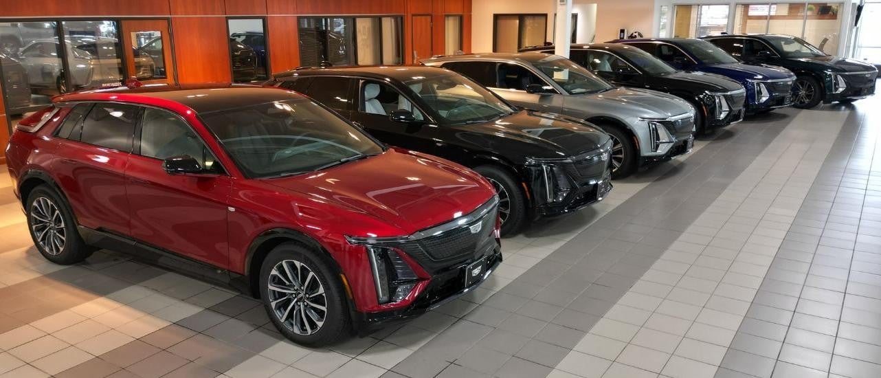 A row of 2024 Cadillac LYRIQ SUVs are shown.