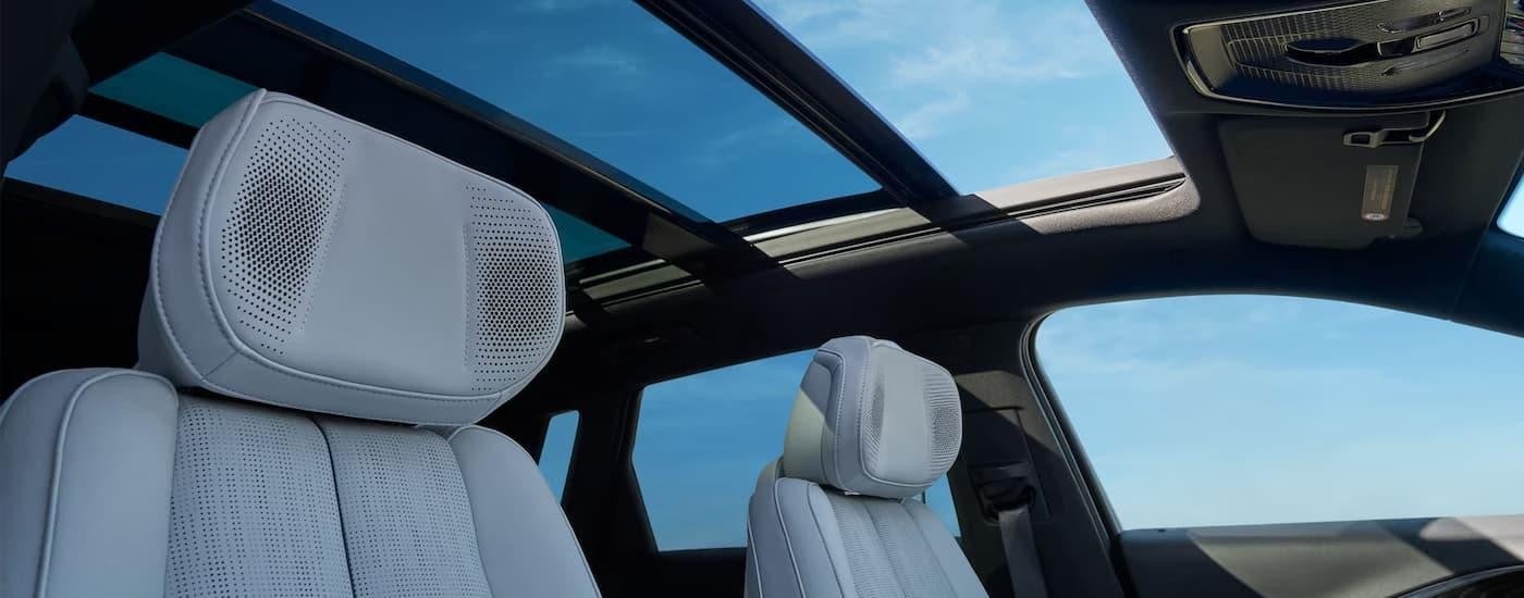 The grey front seats of a 2024 Cadillac LYRIQ for sale is shown.