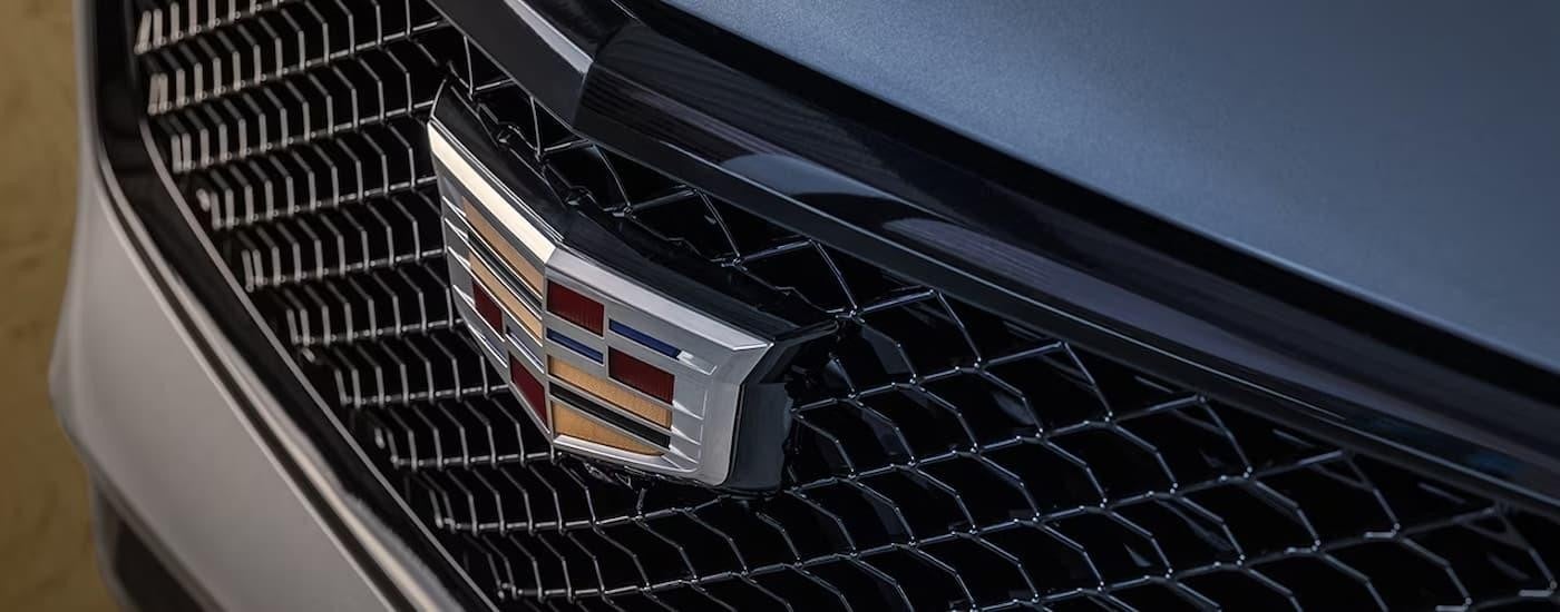 A close up of the grille on a silver 2023 Cadillac XT4 for sale near Belle Plaine is shown.