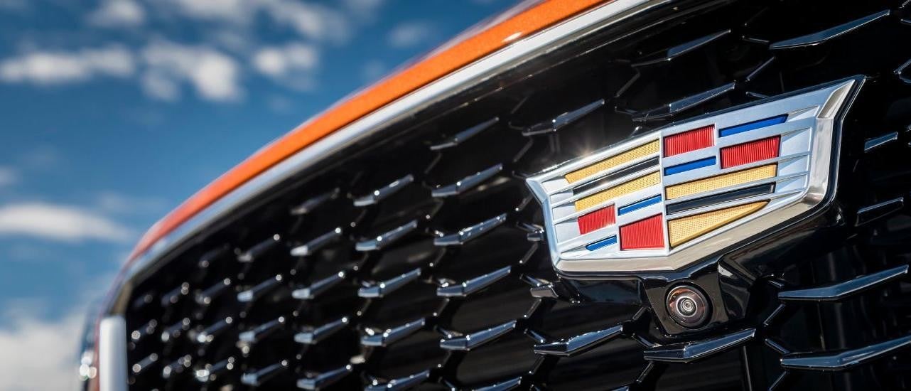 A close up shows the grille on an orange 2019 Cadillac XT4.